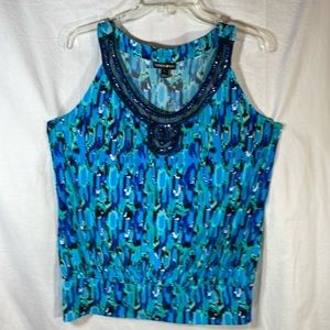 Woman’s Blue sequined top FASHION BUG SZ. Large.